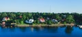 Beautiful super wide-angle aerial view of Stockholm archipelago skerries and suburbs with classic sweden scandinavian designed cot