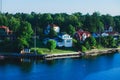 Beautiful super wide-angle aerial view of Stockholm archipelago skerries and suburbs with classic sweden scandinavian designed cot Royalty Free Stock Photo