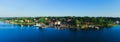 Beautiful super wide-angle aerial view of Stockholm archipelago skerries and suburbs with classic sweden scandinavian designed cot