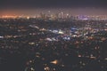 Beautiful super wide-angle night aerial view of Los Angeles, California, USA, with downtown district, mountains and scenery beyond Royalty Free Stock Photo