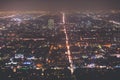 Beautiful super wide-angle night aerial view of Los Angeles, California, USA, with downtown district, mountains and scenery beyond Royalty Free Stock Photo