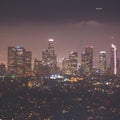 Beautiful super wide-angle night aerial view of Los Angeles, California, USA, with downtown district, mountains and scenery beyond Royalty Free Stock Photo