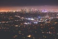 Beautiful super wide-angle night aerial view of Los Angeles, California, USA, with downtown district, mountains and scenery beyond Royalty Free Stock Photo