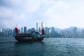 Beautiful super wide-angle summer aerial view of Hong Kong island skyline, Victoria Bay harbor, with skyscrapers, blue sky Royalty Free Stock Photo