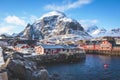 Beautiful super wide-angle winter snowy view of fishing village A, Norway, Lofoten Islands, with skyline, mountains, famous fishin Royalty Free Stock Photo