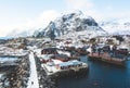 Beautiful super wide-angle winter snowy view of fishing village A, Norway, Lofoten Islands, with skyline, mountains, famous fishin Royalty Free Stock Photo