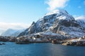 Beautiful super wide-angle winter snowy view of fishing village A, Norway, Lofoten Islands, with skyline, mountains, famous fishin Royalty Free Stock Photo