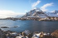 Beautiful super wide-angle winter snowy view of fishing village A, Norway, Lofoten Islands, with skyline, mountains, famous fishin Royalty Free Stock Photo