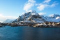 Beautiful super wide-angle winter snowy view of fishing village A, Norway, Lofoten Islands, with skyline, mountains, famous fishin Royalty Free Stock Photo