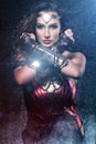 Beautiful superhero woman showing strength