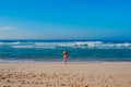 Beautiful surfer girl is enjoying vacation on the tropical beach. Young woman with surfboard in Sri Lanka. Royalty Free Stock Photo