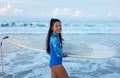 Beautiful Surfer Girl. Surfing Woman With Surfboard. Smiling Brunette Going To Surf In Ocean.