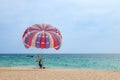 Beautiful Surin beach in Choeng Thale city, Phuket, Thailand with colorful parachute white sand, turquoise water and palm trees