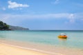 Beautiful Surin beach in Choeng Thale city, Phuket, Thailand with white sand, turquoise water and palm trees