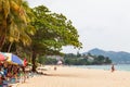 Beautiful Surin beach in Choeng Thale city, Phuket, Thailand with white sand, turquoise water and palm trees