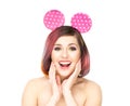 Beautiful surprised woman in Mickey mouse ears
