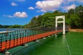 The beautiful suspension bridge connecting the small islands in the lake at Chengching Lake Royalty Free Stock Photo