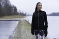 Beautiful Swedish caucasian fitness teen girl standing on wood bridge outdoor in winter landscape Royalty Free Stock Photo