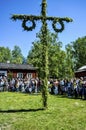 Beautiful swedish people and kids are enjoying mid summer day with pole stand in sunny day with colourful dresses