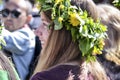 Beautiful swedish people and woman are enjoying mid summer day wearing crown made of leaves in sunny day