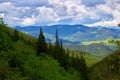 Beautiful swiss alps. Amazing mountain view with high peaks, green hills and clouds low in the valley Royalty Free Stock Photo