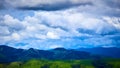 Beautiful swiss alps. Amazing mountain view with high peaks, green hills and clouds low in the valley Royalty Free Stock Photo