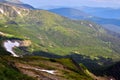 Beautiful swiss alps. Amazing mountain view with high peaks, green hills and clouds low in the valley Royalty Free Stock Photo