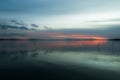 Beautiful and symmetric sunset over Trasimeno lake Umbria, Italy