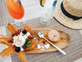 Beautiful table with cocktails, dessert on a wooden tray. Premium service during a vacation on a tropical island Royalty Free Stock Photo