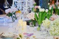 Beautiful table set with candles and flowers Royalty Free Stock Photo