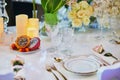 Beautiful table set with candles and flowers Royalty Free Stock Photo