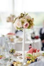 Beautiful table set for a party, wedding reception or festive event. Fruits and appetizers for event dinner. Stylish flowers Royalty Free Stock Photo