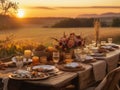 Beautiful table setting for breakfast in the countryside at sunset.