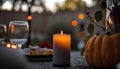 Beautiful table setting with candles and pumpkins at sunset, selective focus Royalty Free Stock Photo