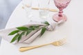 Beautiful table setting with crockery and flowers for a party, wedding reception or other festive event. Glassware and Royalty Free Stock Photo