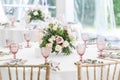Beautiful table setting with crockery and flowers for a party, wedding reception or other festive event. Glassware and Royalty Free Stock Photo