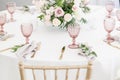 Beautiful table setting with crockery and flowers for a party, wedding reception or other festive event. Glassware and Royalty Free Stock Photo