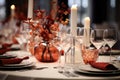 Beautiful table setting with flowers and candles in restaurant, closeup, Beautiful decorated table at restaurant. Light background Royalty Free Stock Photo