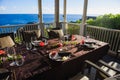 Beautiful table setting on terrace near ocean