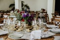 Beautiful table setup for a wedding reception with colorful flower arrangement centerpiece Royalty Free Stock Photo