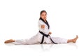 One punch tae kwon do girl doing split, full length portrait isolated