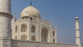 Beautiful Taj Mahal against the blue sky. Symmetrical white marble mausoleum