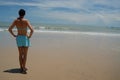 Beautiful tall brunette woman on the beach