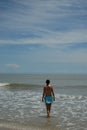 Beautiful tall brunette woman on the beach