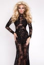 Beautiful tall slim blonde with amazing body dressed in an elegant dress lace dress Royalty Free Stock Photo