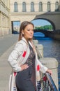 Sunny day, beautiful girl on the waterfront Royalty Free Stock Photo