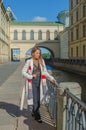 Sunny day, beautiful girl on the waterfront Royalty Free Stock Photo