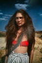 Beautiful tanned girl in the desert