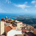 Beautiful Taormina sea coast panoramic view from Castelmola mountain village and Castelmola roofs, Sicily, Italy. People