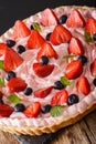 Beautiful tart with strawberries and blueberries with whipped cr